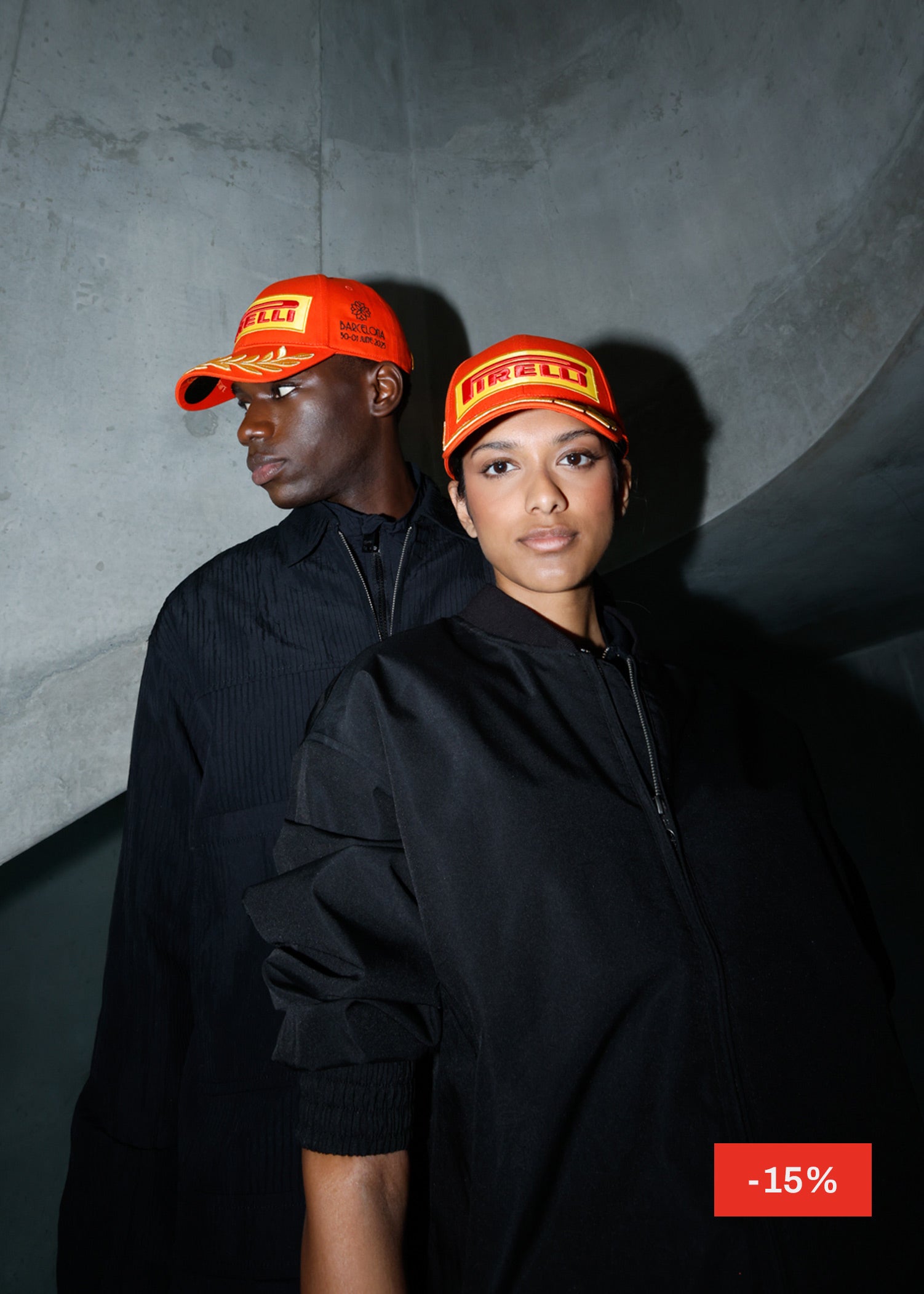 Man and woman in orange Pirelli caps