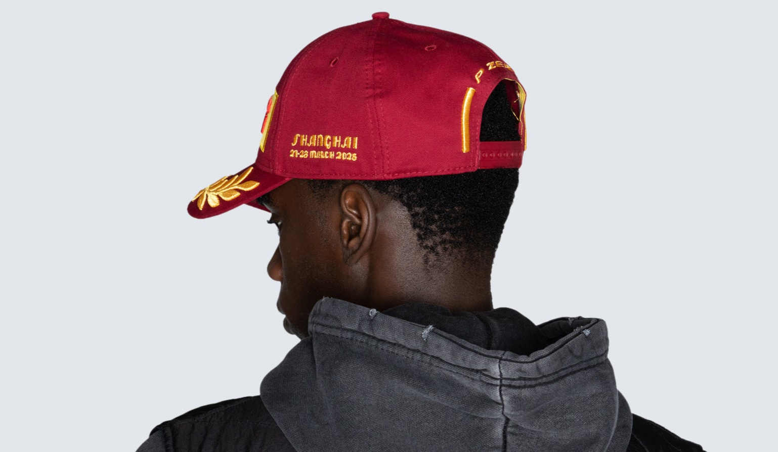 man with red cap back view