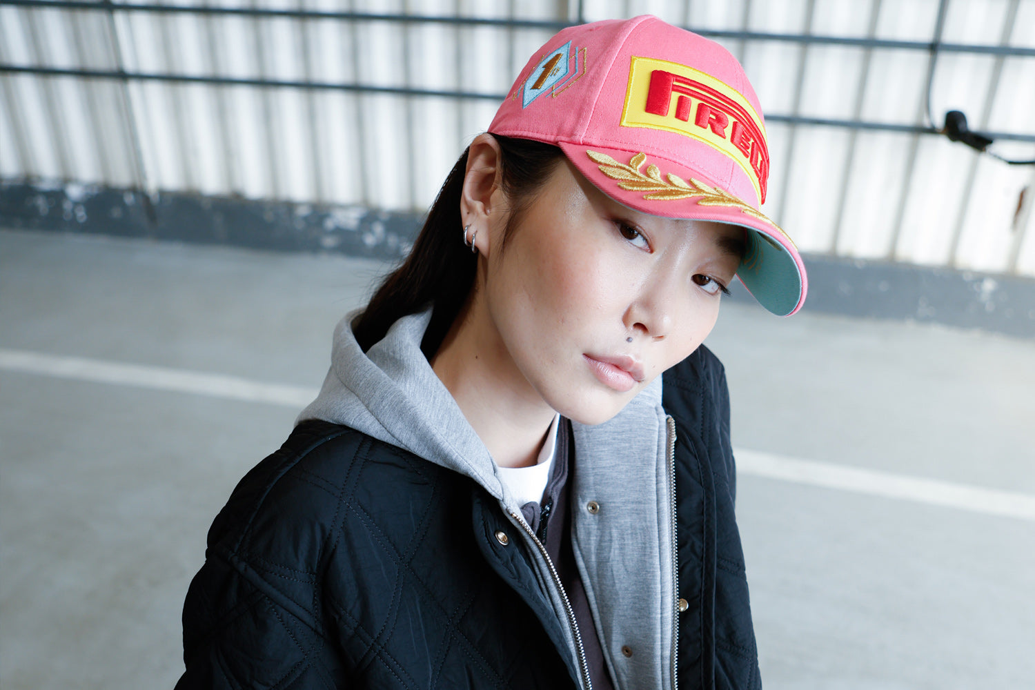woman in pink Pirelli Podium Cap