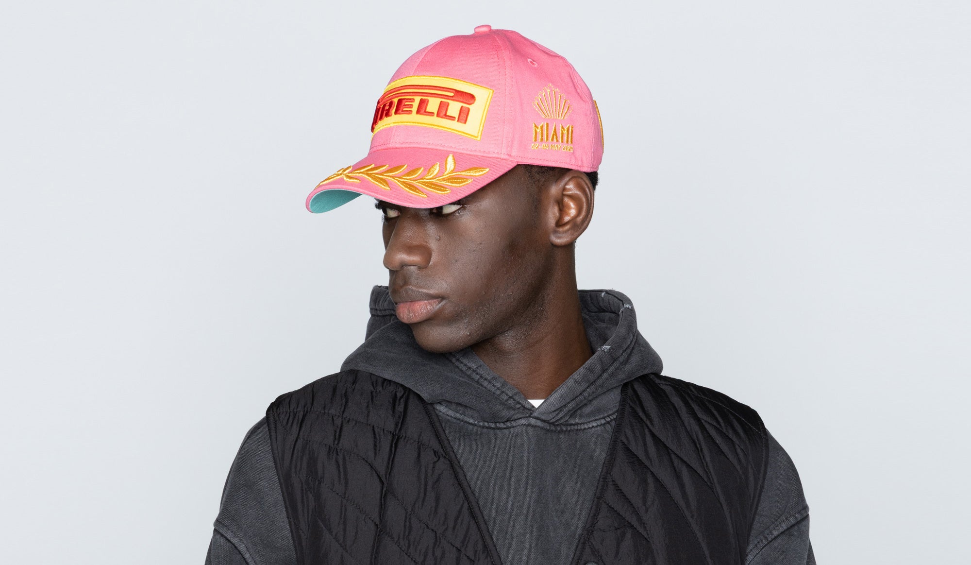 man in pink Pirelli Podium Cap