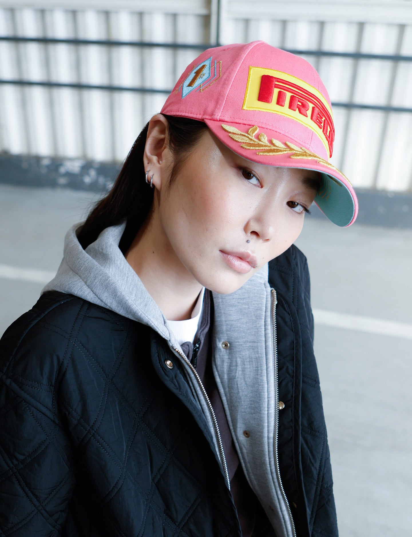 woman in pink Pirelli Podium Cap