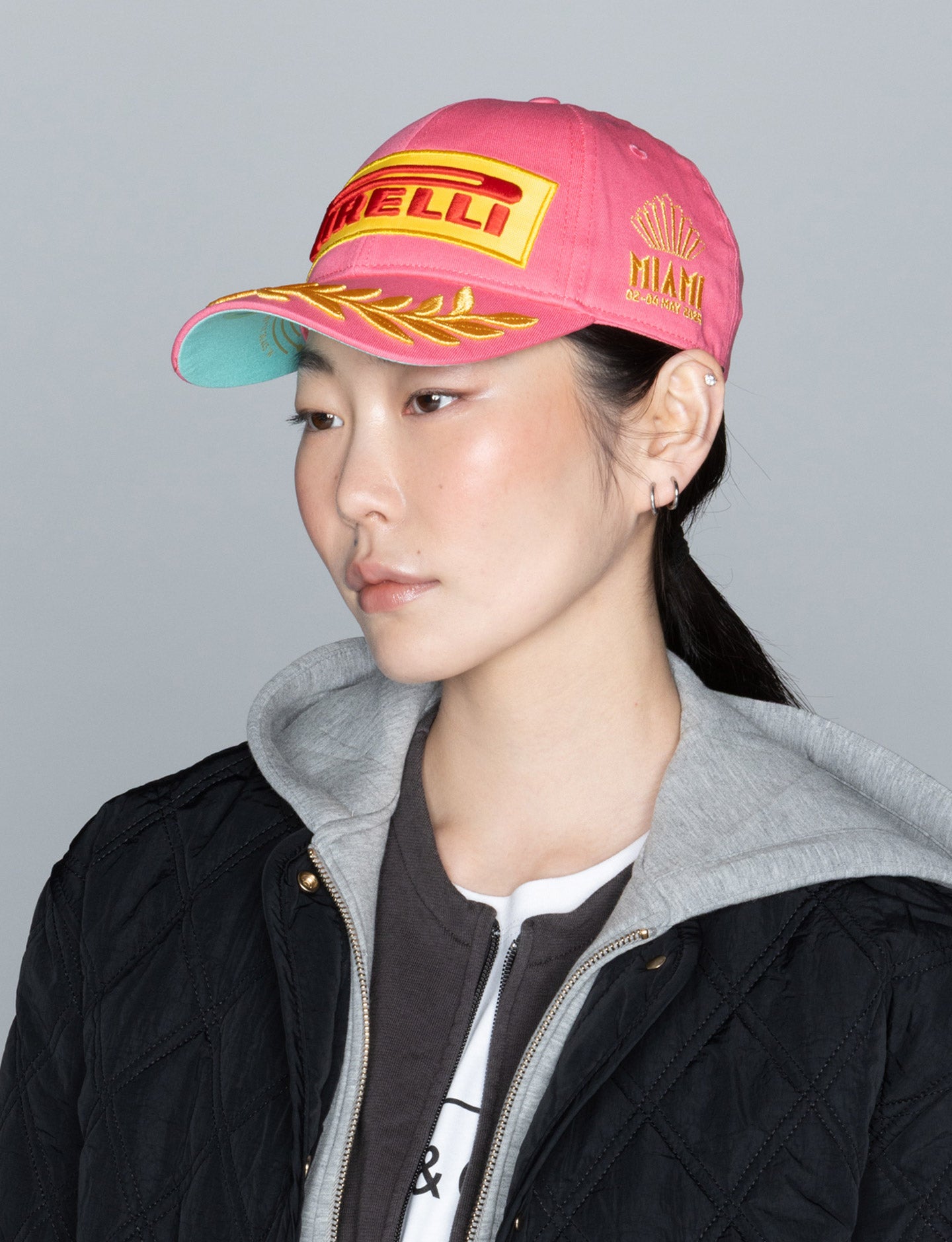 woman in pink Pirelli Podium Cap
