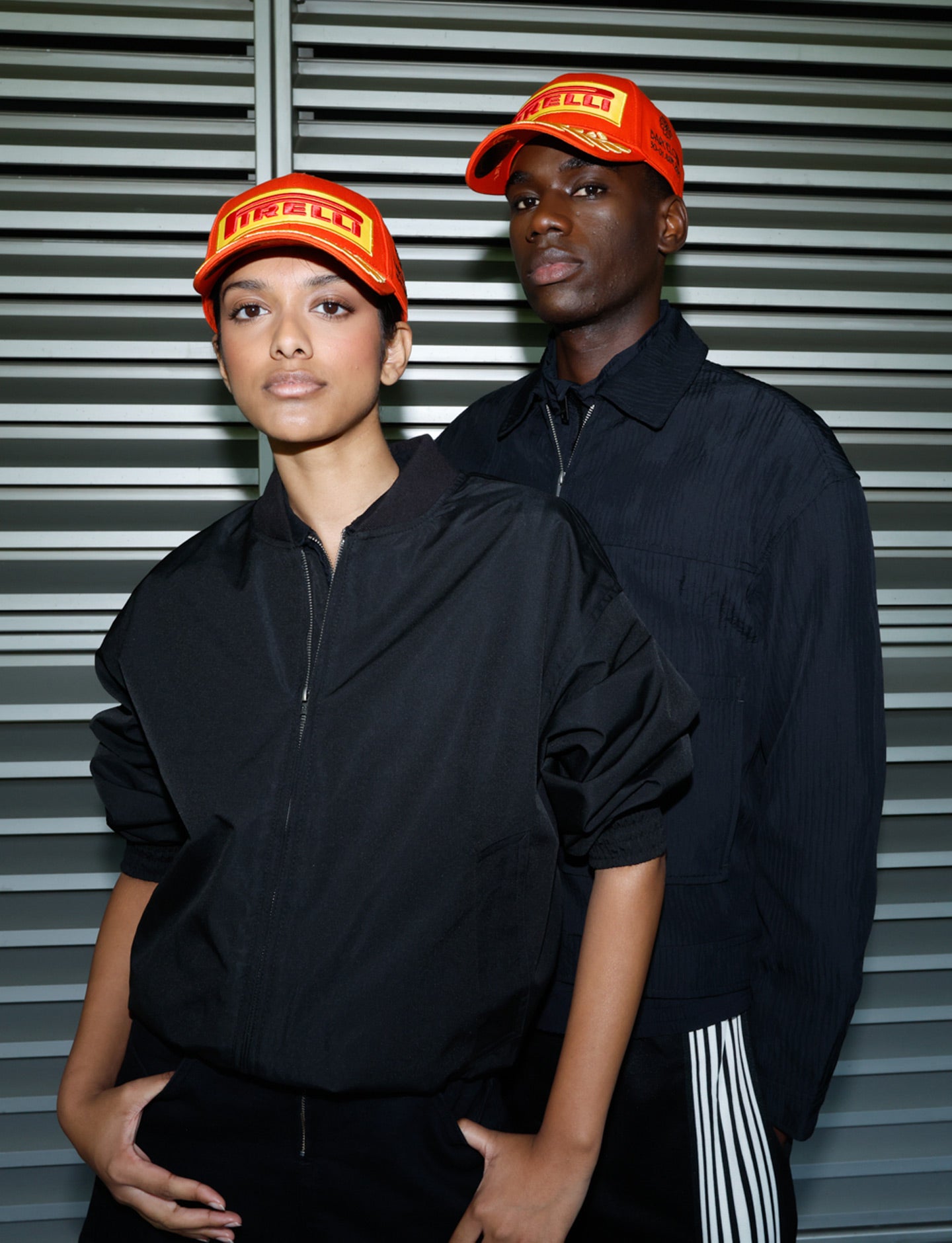 man & woman in Orange Pirelli Podium Cap
